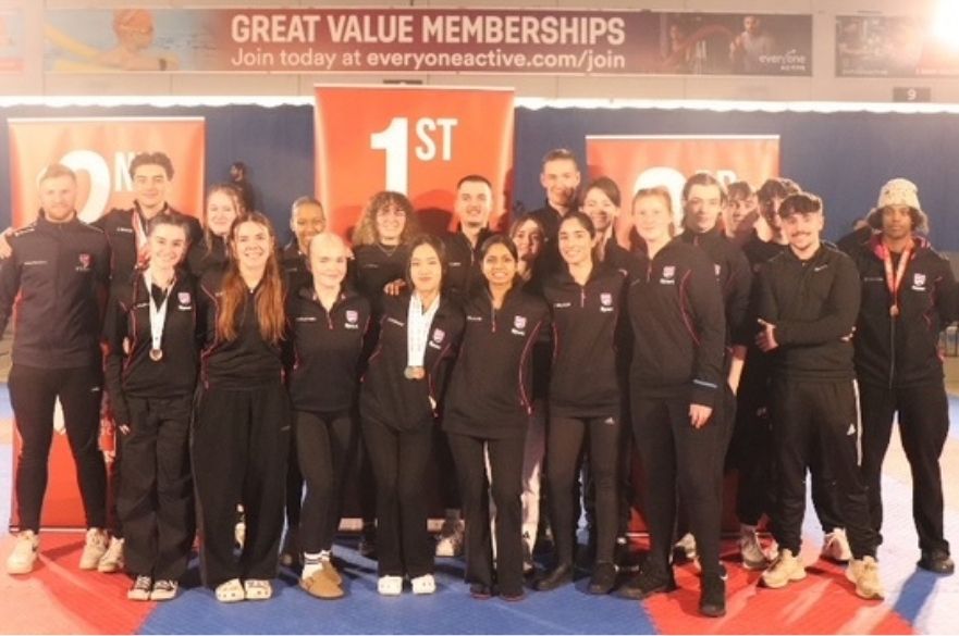 karate members with medals after winning event 