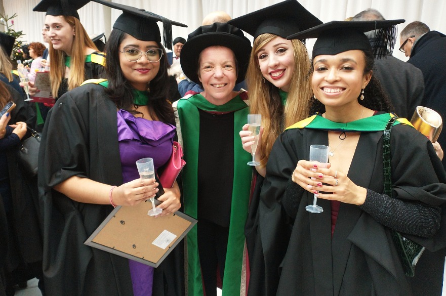 Emma with her students at graduation