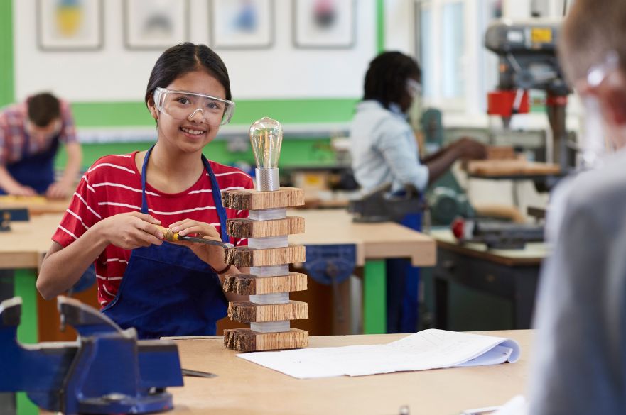 Female High School Student Making Lamp In Woodwork Lesson, curriculum reform, design and technology education
