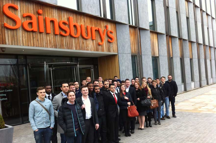 A group of students standing outside Sainsbury's