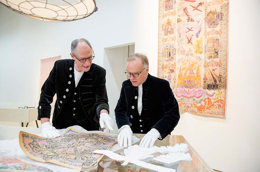 The High Sheriffs looking at the drawings that inspired their jabots