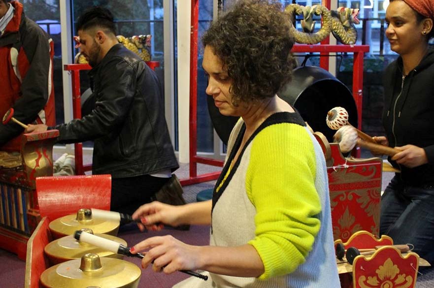 Woman playing metallophone in Gamelan workshop