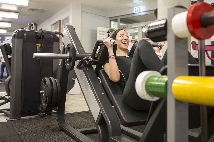 Female using gym equipment