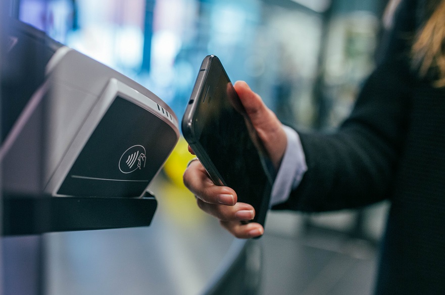 Woman paying by phone