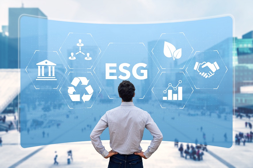 Man in front of a board with sustainability logos