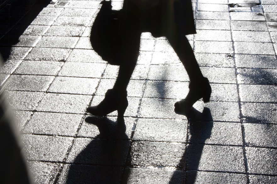 Shadow of a woman walking