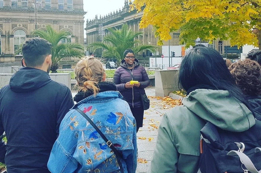 Young women leads a tour