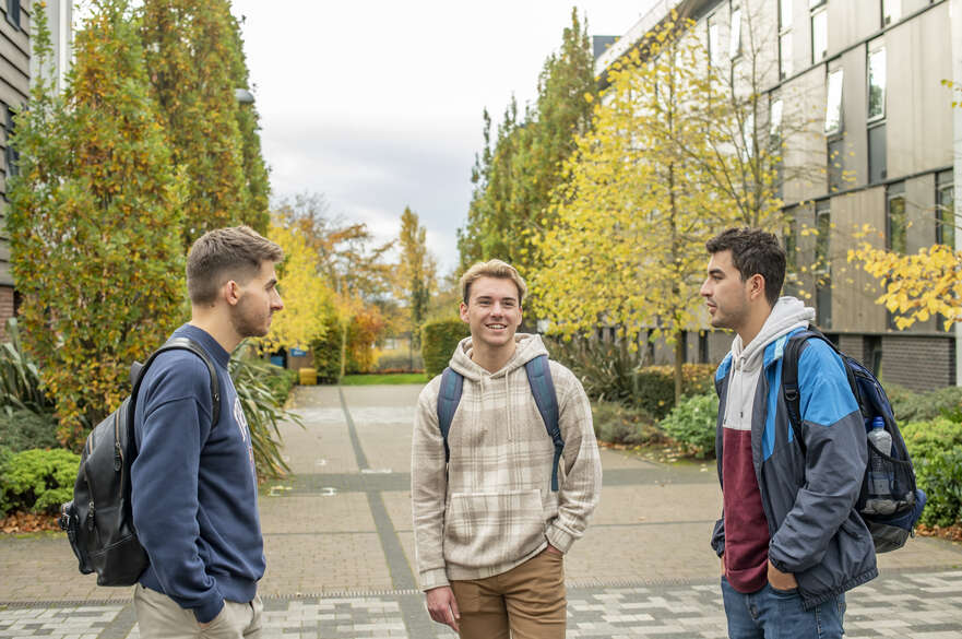 Three students outside accommodation