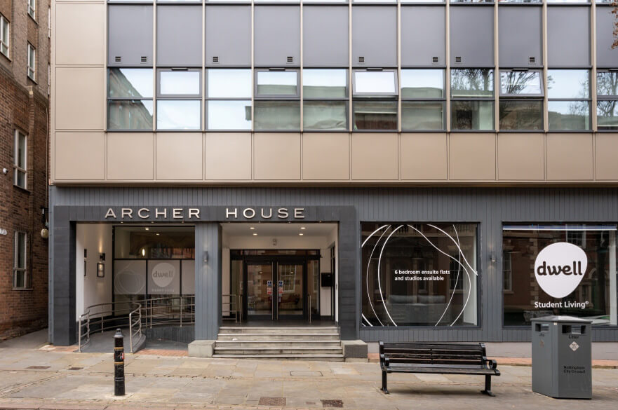 Entrance to Archer House student accommodation with branded frontage on a city-centre street.