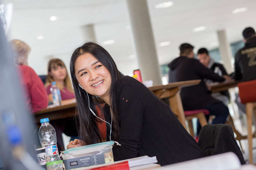 Student sat smiling