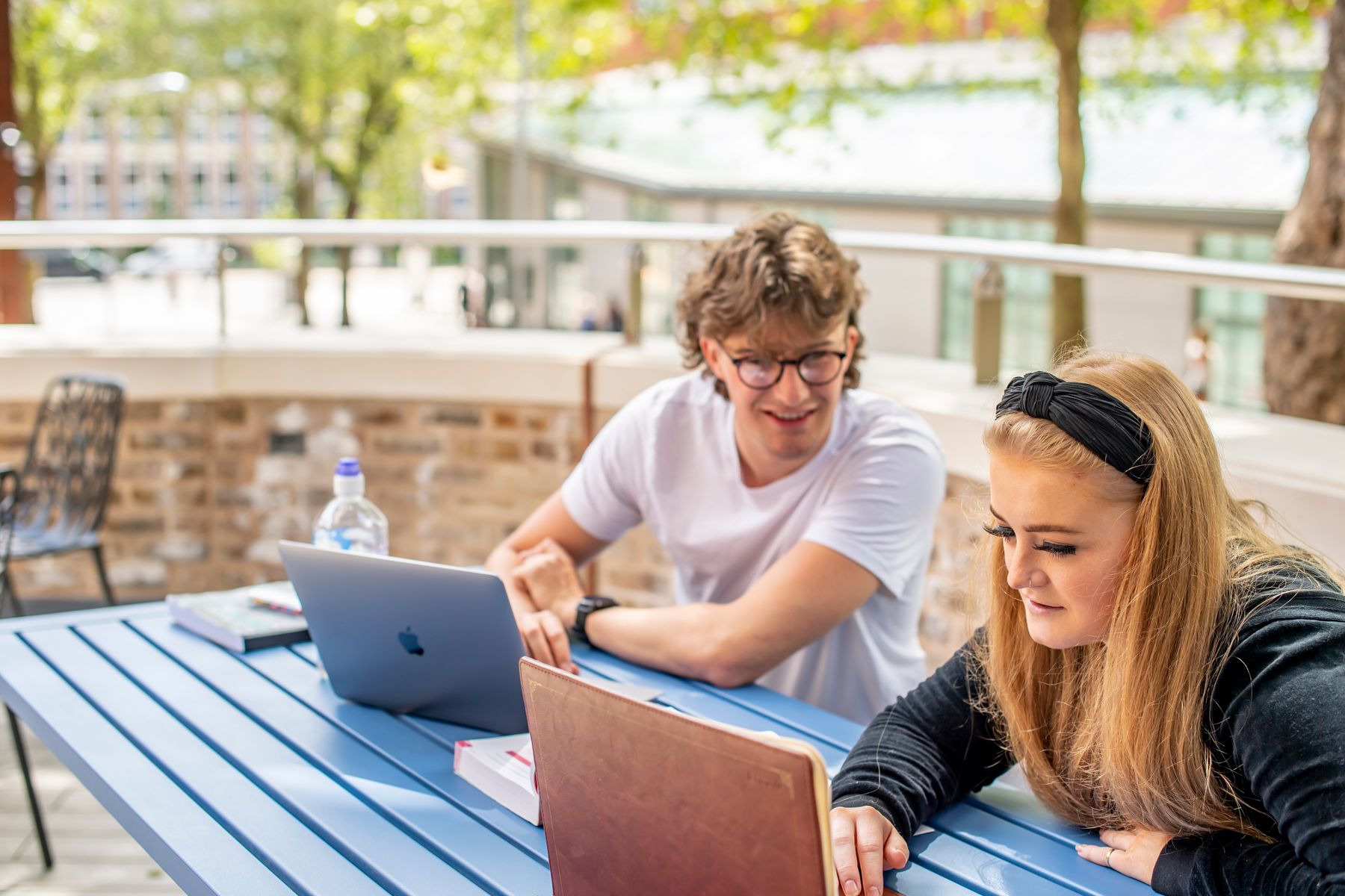 girl and boy on laptops