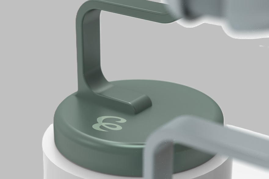 A close-up of the button and logo on a new hair curling product.