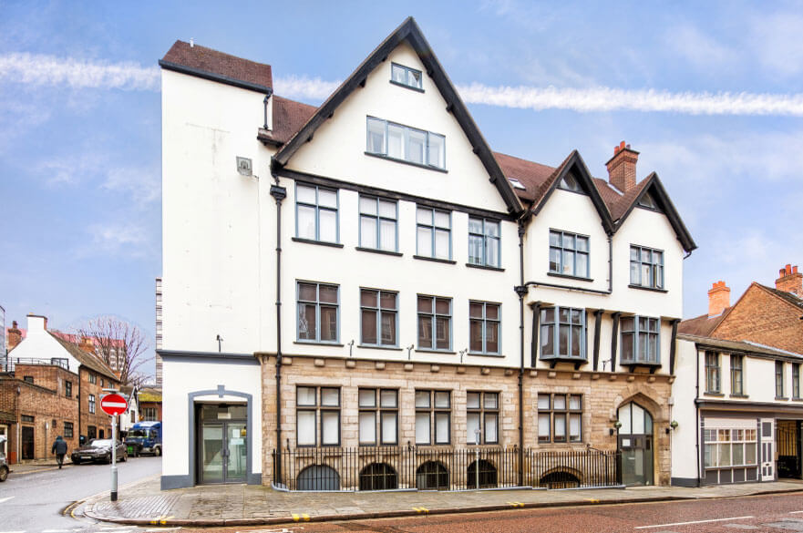 Historic multi-storey student accommodation building with cream exterior, gabled roof in Nottingham city centre.