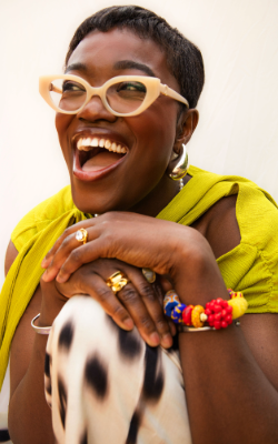 A person posed for a photograph, smiling.