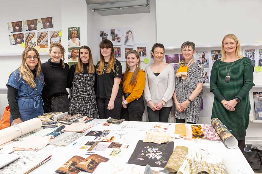 One of the Romo winning groups with members of the Romo team