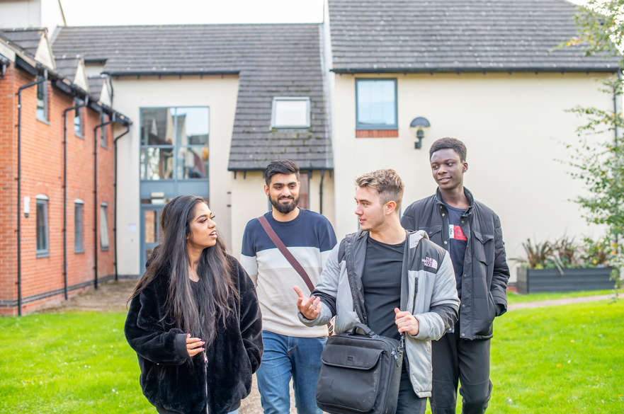 A group of students walking around Brackenhurst accommodation