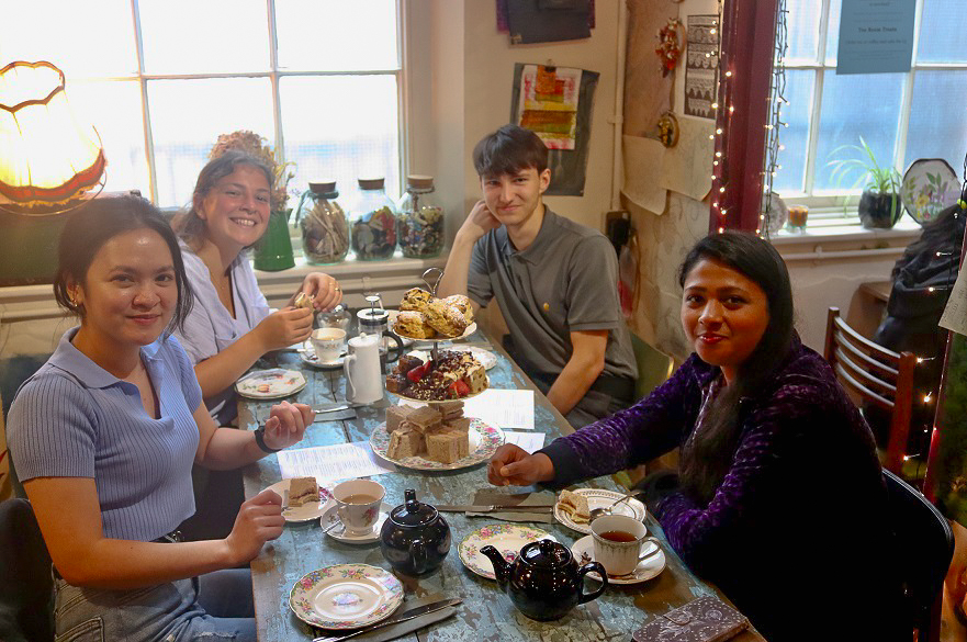 group of global summer school students enjoying an english aftertoon tea