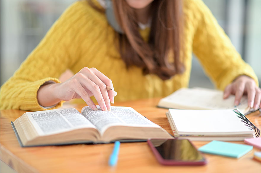Girl sat at desk studying