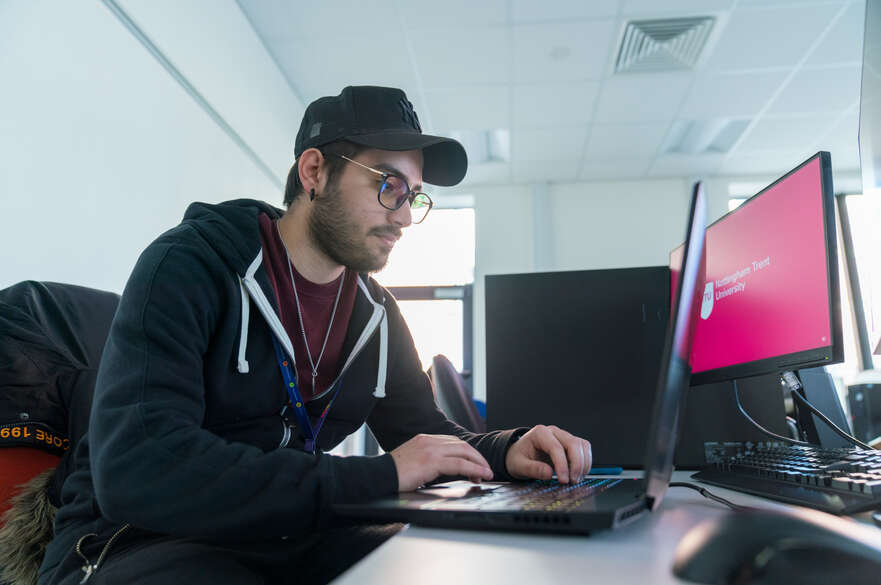 A student works on a laptop