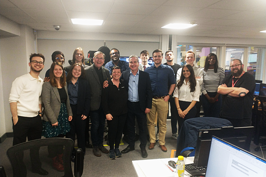 Emma and her colleagues inside of the Newsroom at CBJ in NTU