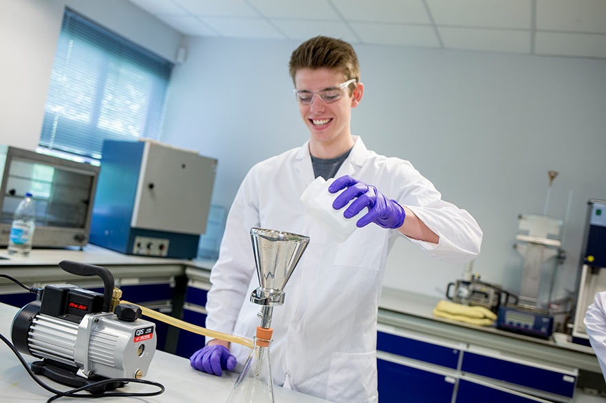 Student carrying out laboratory experiment