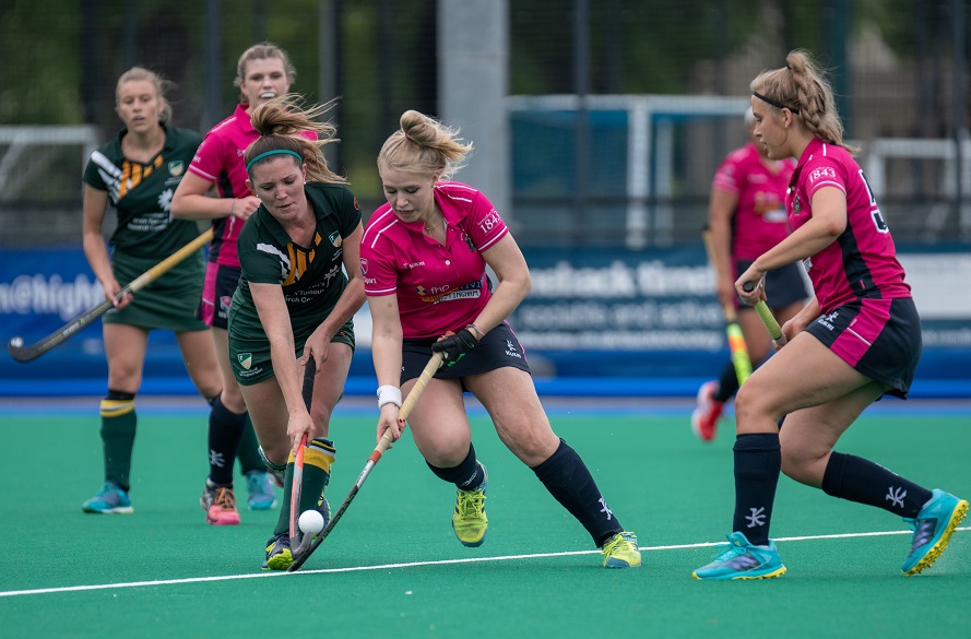 NTU Female hockey player running with the ball