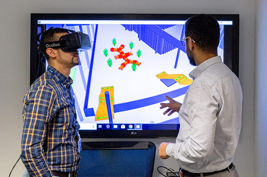 Academic and postgraduate researcher using the virtual reality technology in the creative and virtual technologies laboratory