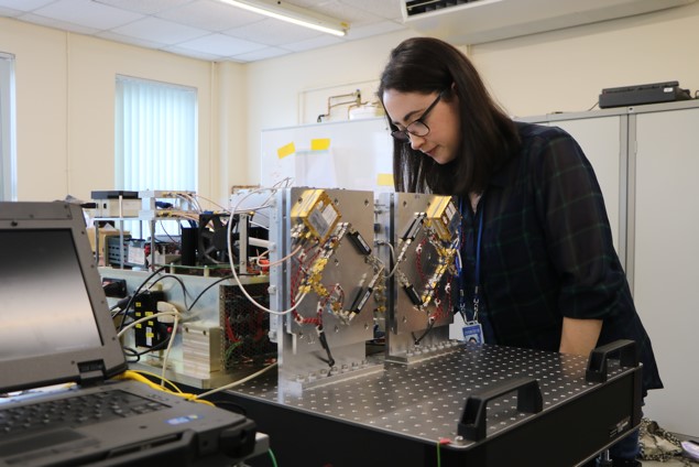 Photograph of student working on machinery