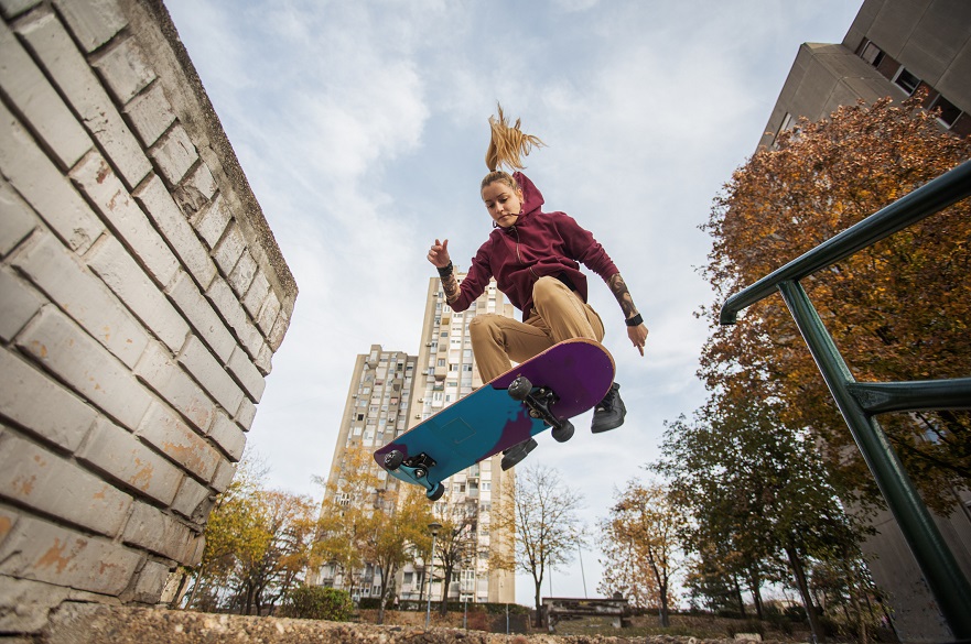 Female skateboarder performing a jump