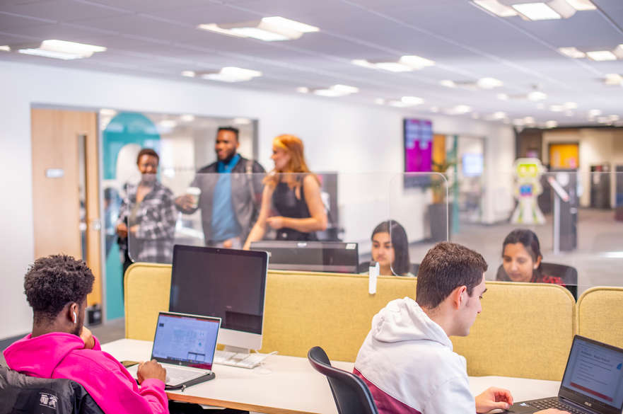 students working in Dryden foyer