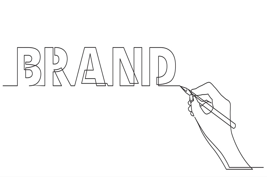 A white background with an illustration of a hand with a pen writing the word 'brand' in block capital letters