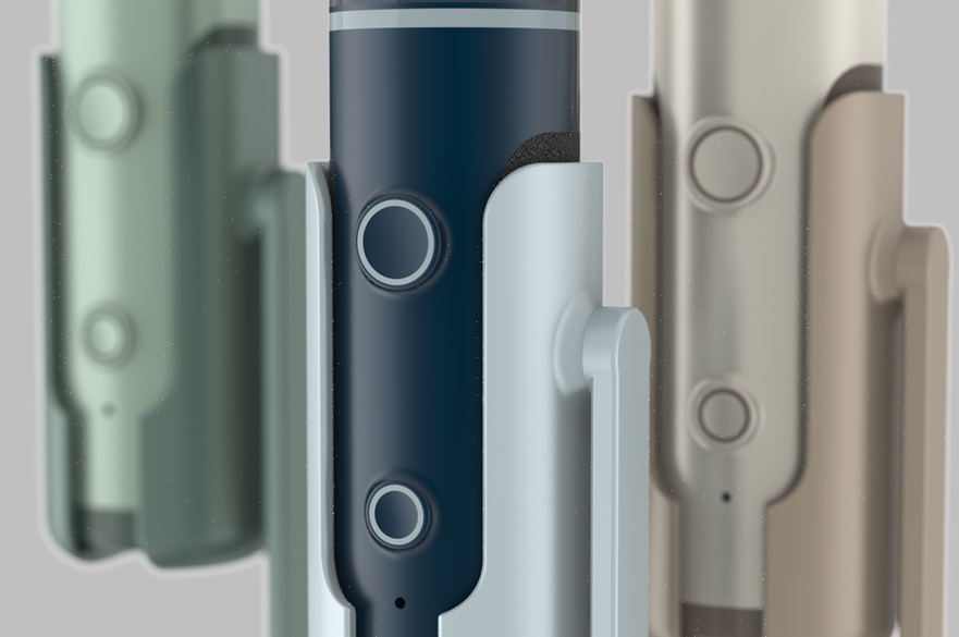 Close up of the buttons on three hair curling appliances.