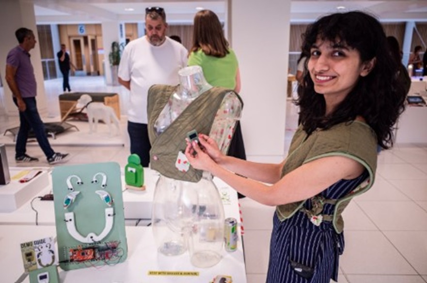 An image of a product design student at the opening night