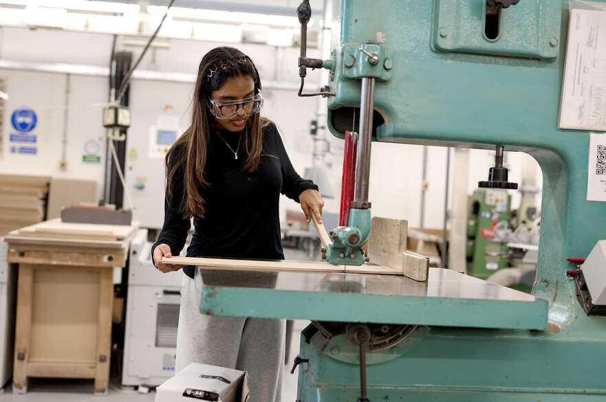 Student using bandsaw