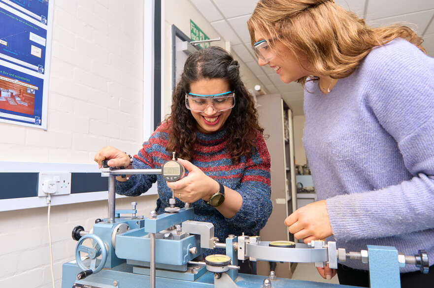 Two students using equipment in Civil Engineering facilities on NTU's City Campus