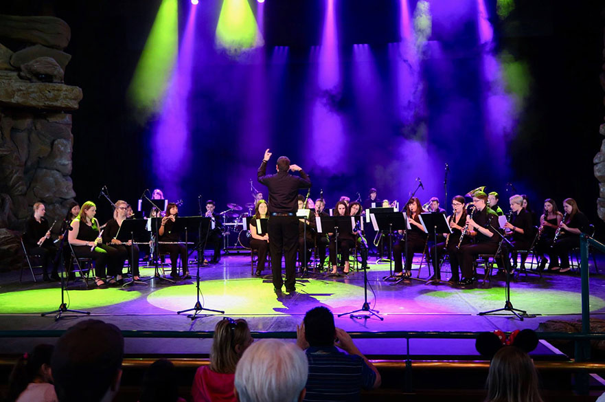 students performing on stage at Disneyland