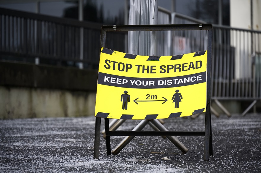 Social distancing sign on street