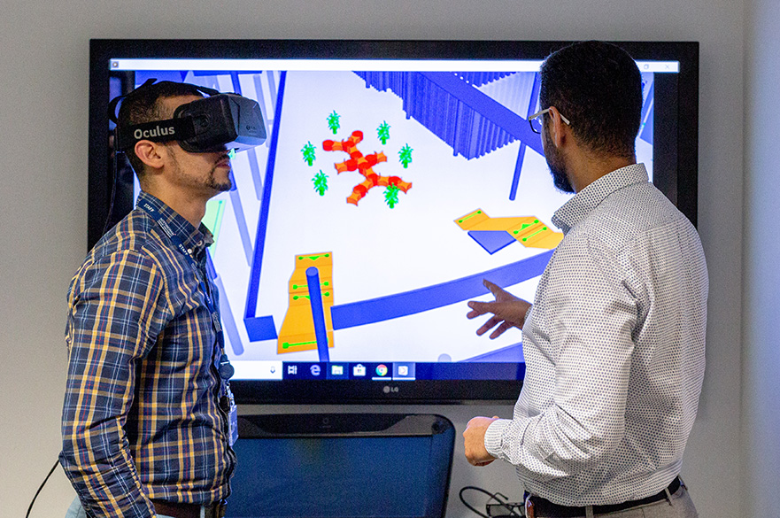 Researchers using a virtual reality headset