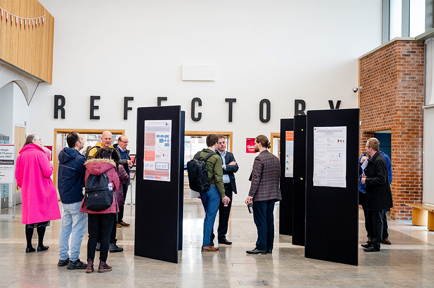 Image of research colleagues from NTU coming together in the Clifton Pavilion for a conference