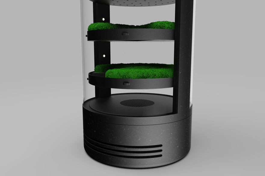The lower half of an upright cylindrical air purifier that has layers of moss inside through which the air is filtered.