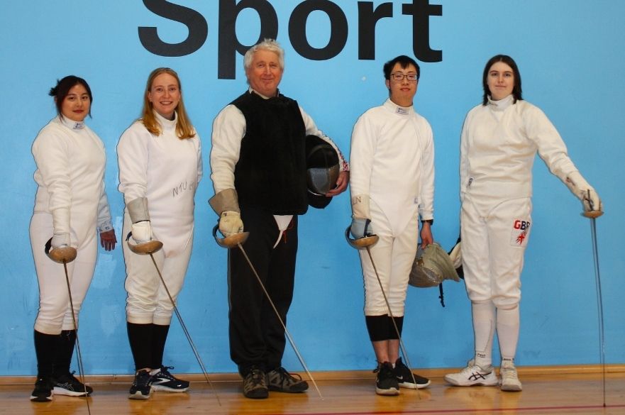 fencing members posing for the camera