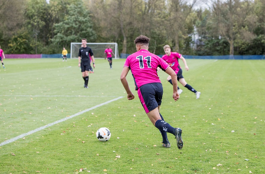 Male NTU Football Player on the ball