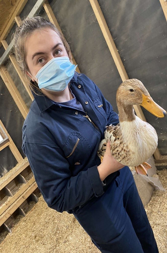 Student holding duck