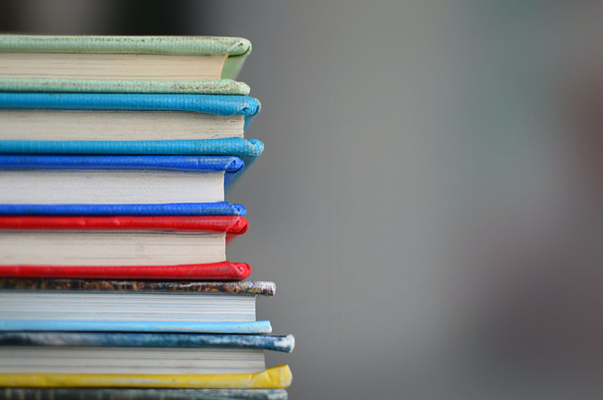 A stack of brightly coloured books