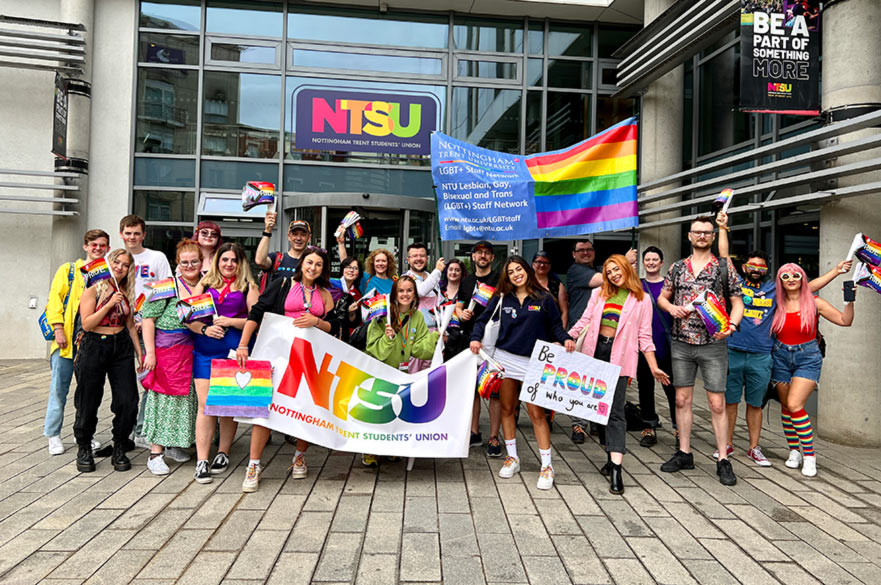 A large crowd gathered outside the City Campus NTSU building, all dressed in rainbow colours and ready for Pride.