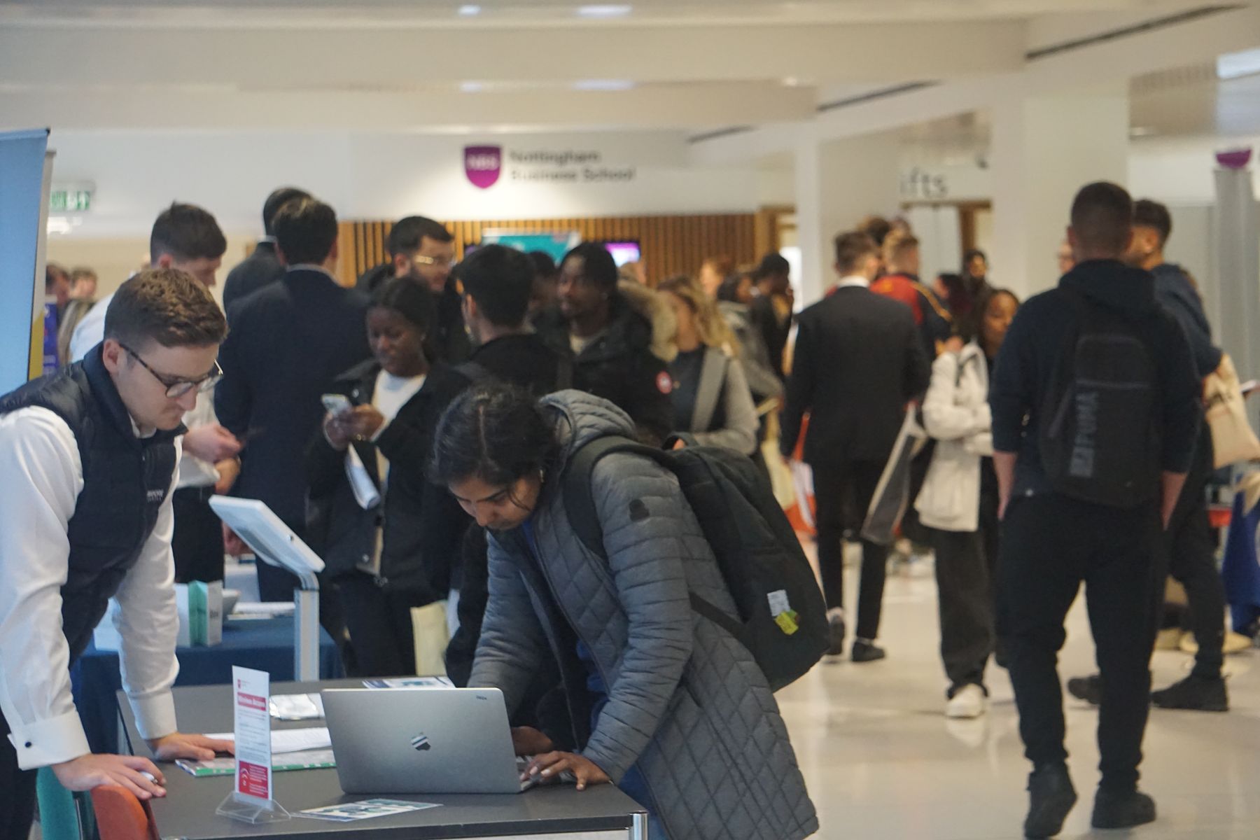 Student looking at employer stand at fair
