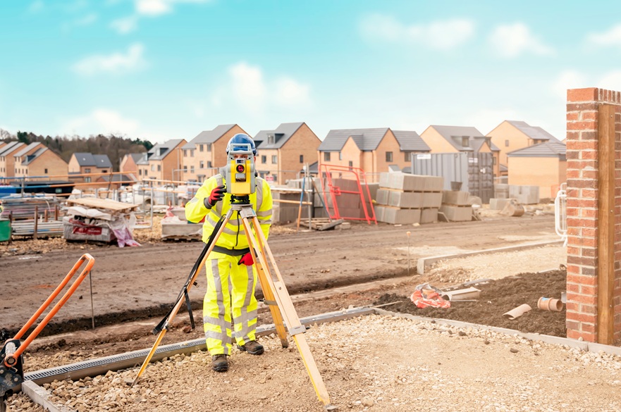 A surveyor on a construction site