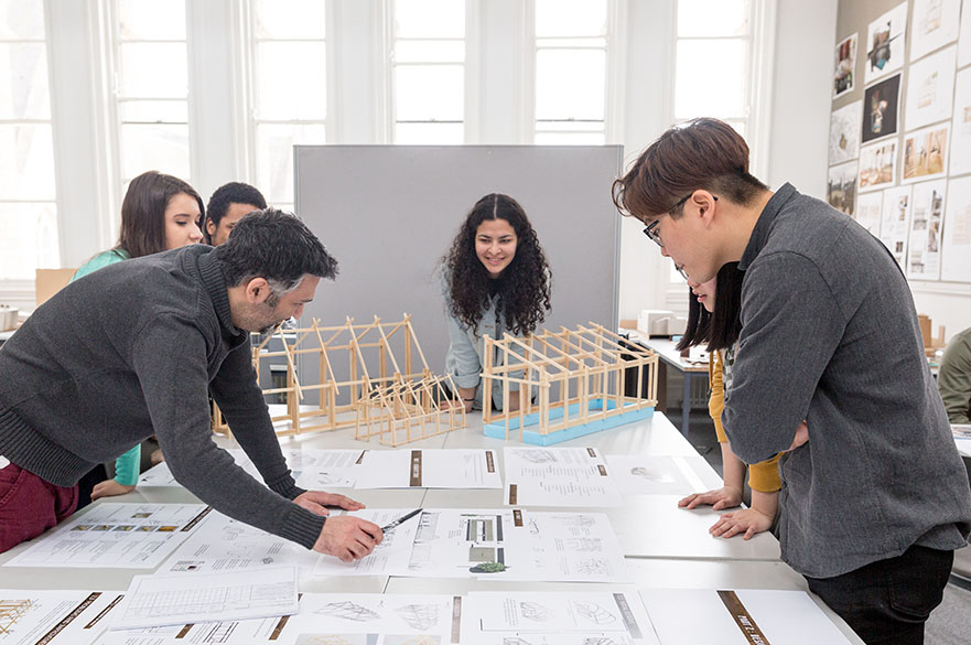 Architecture students and academic working on a project in the Arkwright studio.