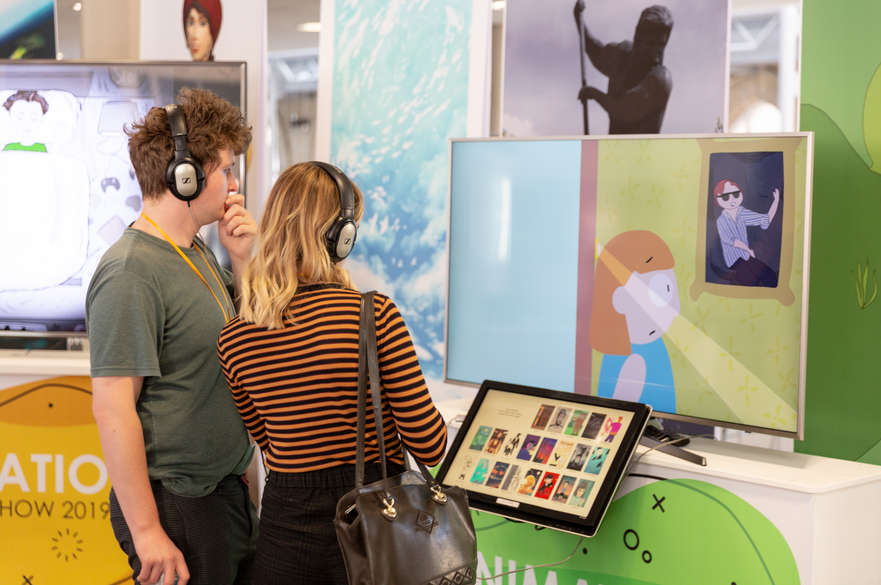 Visitors watching an animation