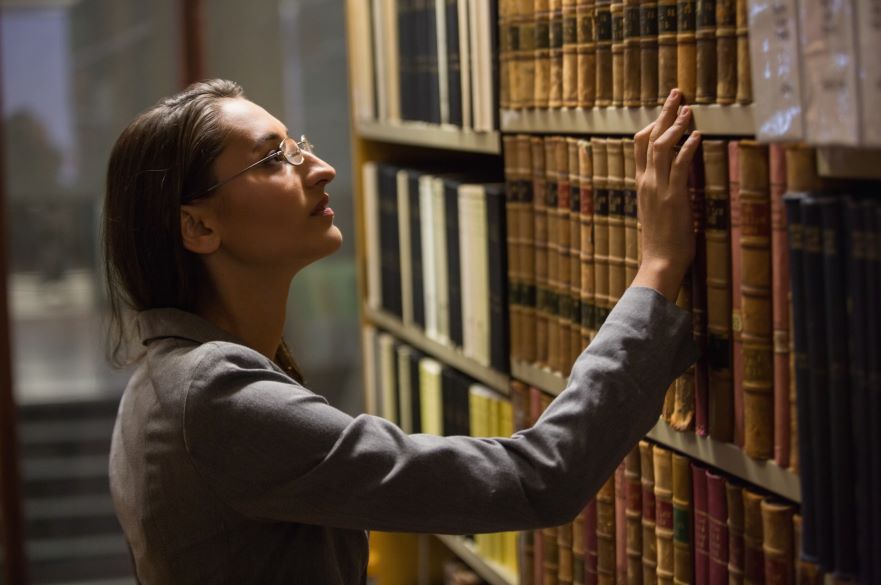 Female Lawyer Looking at Books